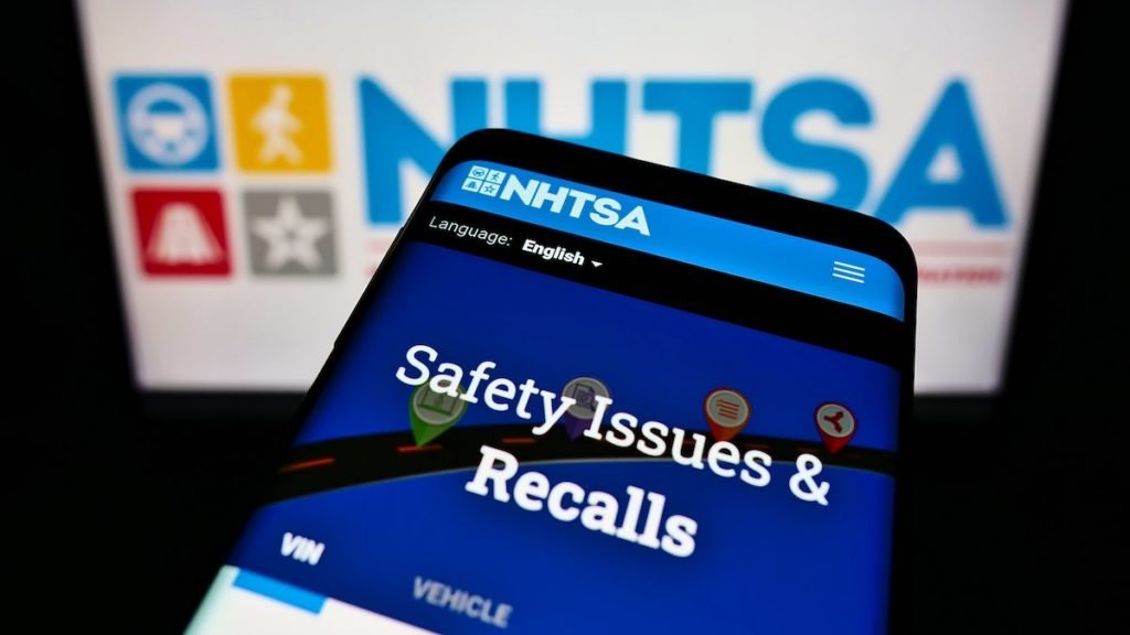 STUTTGART, GERMANY - May 31, 2021: Mobile phone with website of National Highway Traffic Safety Administration (NHTSA) on screen in front of logo. Focus on top-left of phone display.
