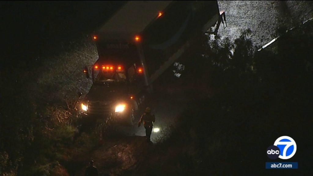 Amazon delivery truck stuck on hill in Montecito Heights, threatening home below - KABC-TV