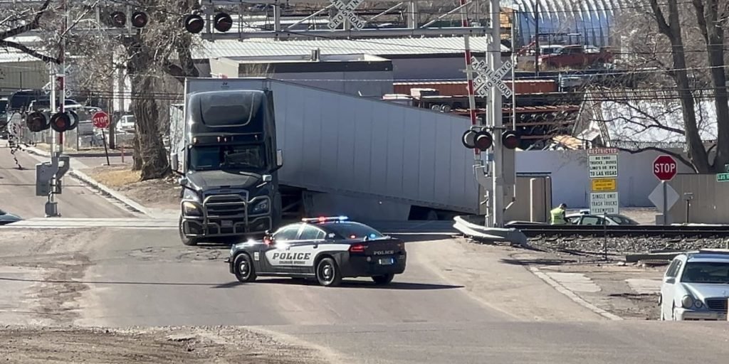 Semi-truck stuck on railroad tracks near downtown Colorado Springs - KKTV