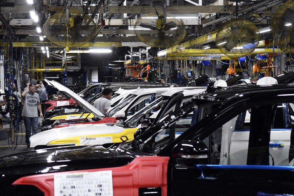 FILE - Workers assemble Ford trucks at the Ford Kentucky Truck Plant, Friday, Oct. 27, 2017, in Louisville, Ky. The United Auto Workers union said Friday, Feb. 16, 2024, members will go on strike Feb. 23 at the Kentucky Truck Plant, Ford’s most profitable factory, if a local contract dispute is not resolved.  (AP Photo/Timothy D. Easley, File)