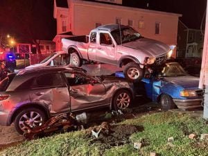 Truck goes airborne, lands on top of several vehicles after striking building in Brockton - Yahoo! Voices