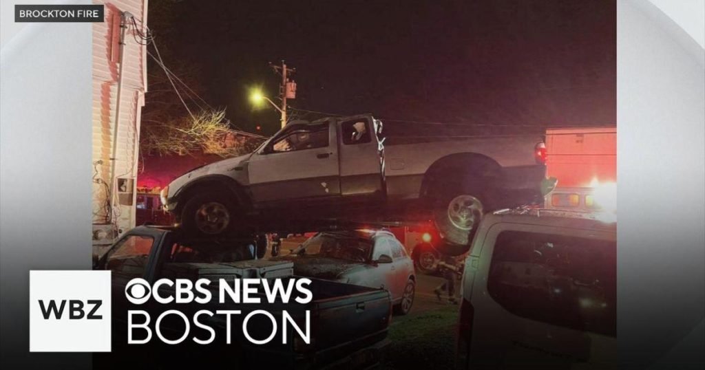 Driver flees after pickup truck lands on parked cars in Brockton - CBS Boston