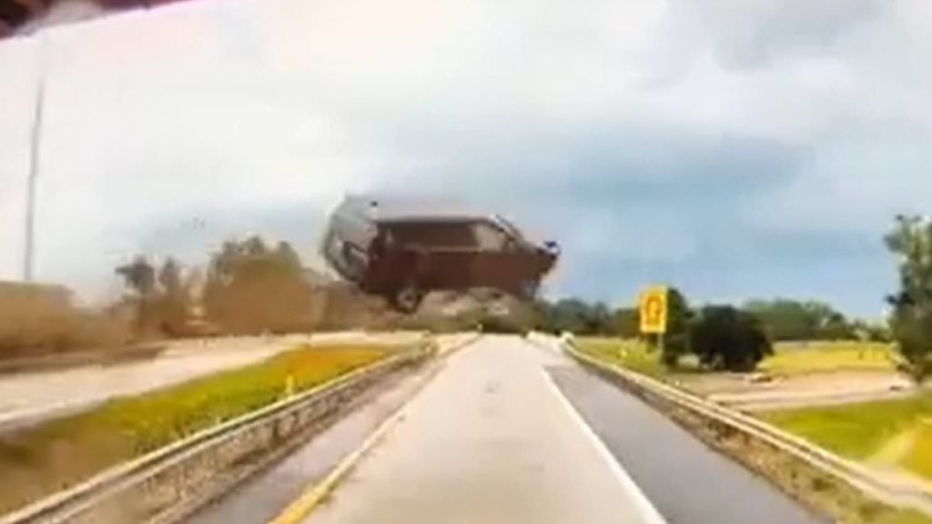 Wild moment SUV goes MEGA airborne in front of truck driving on Michigan highway - Daily Mail