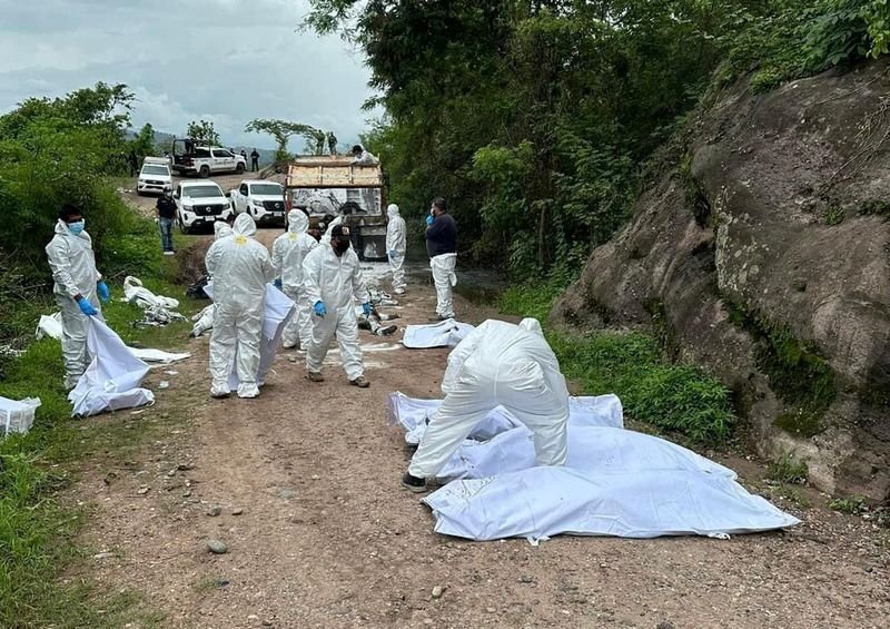 Forensic technicians work at a scene where authorities found several bodies linked to a gunfight between criminal gangs, in La Concordia, Chiapas state, Mexico, in this handout distributed on July 1, 2024. Chiapas State Prosecutor Office/Handout via REUTERS